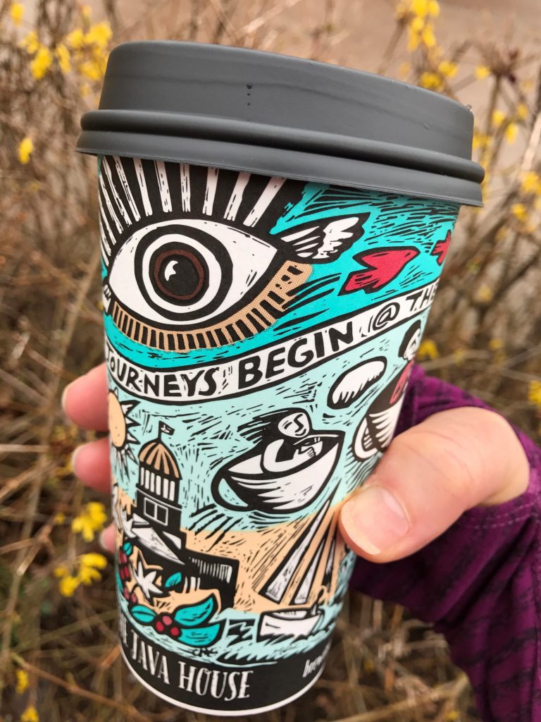 Coffee cup with a scraperboard design by Claudia McGehee